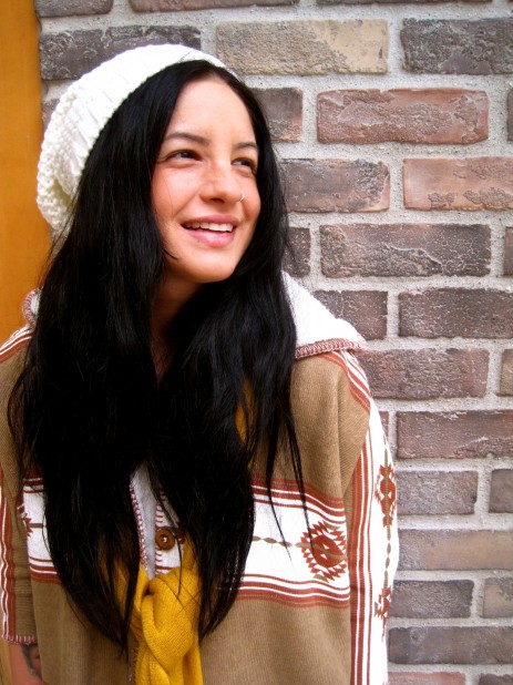 The white beanie and mustard scarf are great accessories for this RVCA cape!